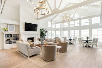A living room with a fireplace and a television